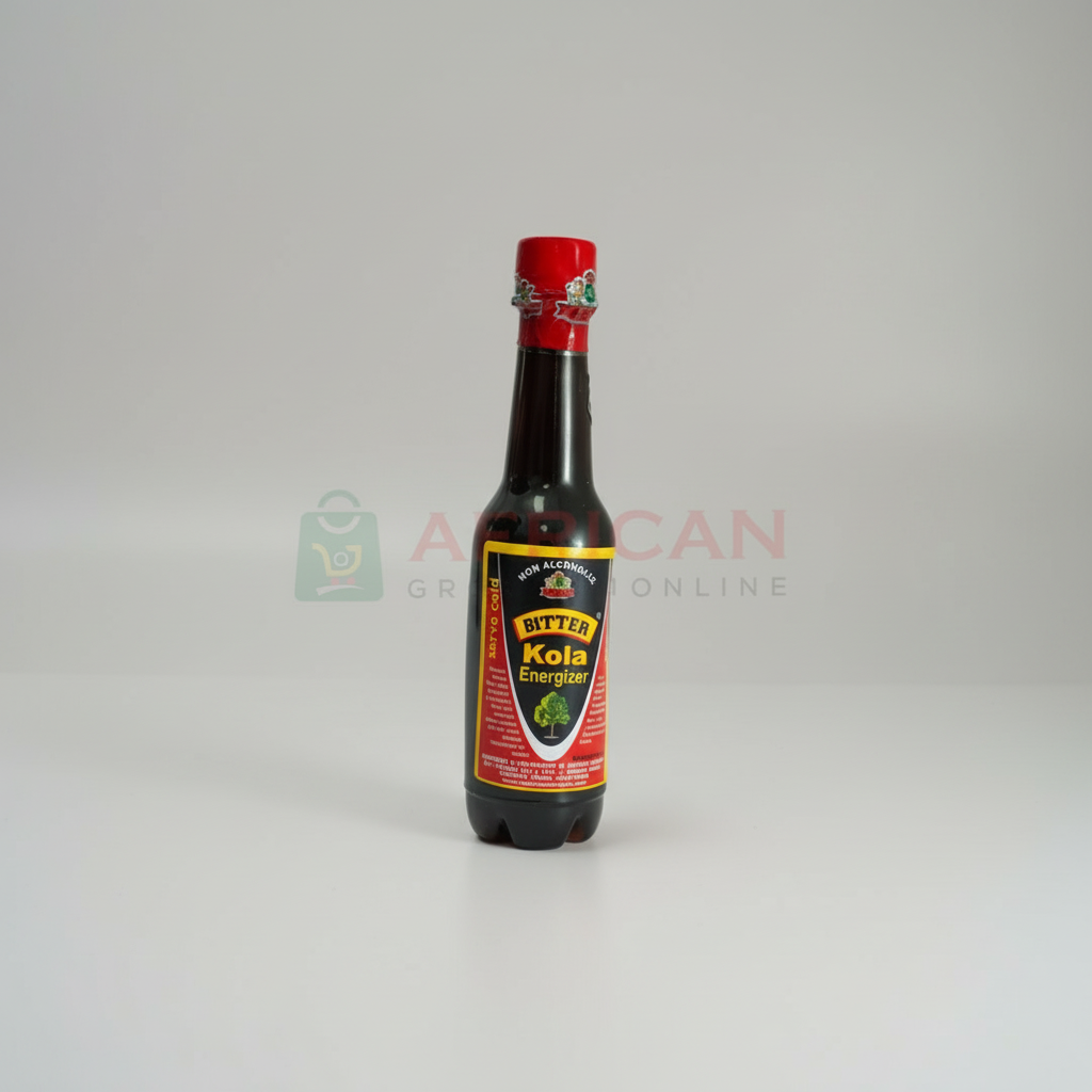 A bottle of BITTER KOLA KADCO with a red cap on a white background, labeled with the product name and a website address.