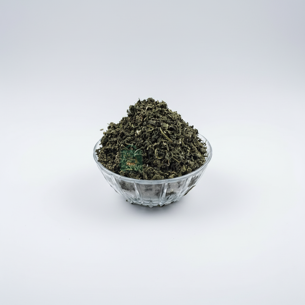 A clear glass bowl filled with dried green bitters leaf, with a watermark indicating the image was taken by 'African Grocery Online'.