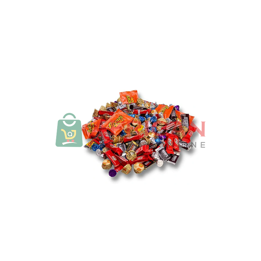 A pile of various candies, with different packaging and colors visible.
