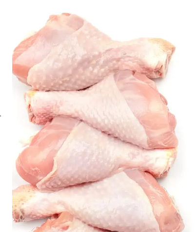 Raw chicken legs on a white background