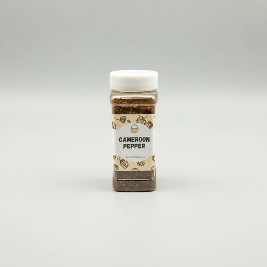 A bottle of BCS CAMEROON PEPPER, with the label showing the product name and a website address.