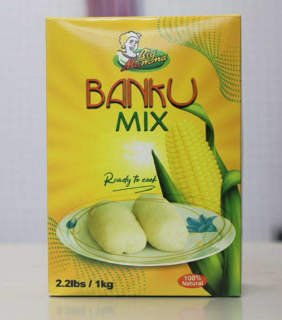 Box of Big Mama Banku Mix with corn and plantains on a yellow background