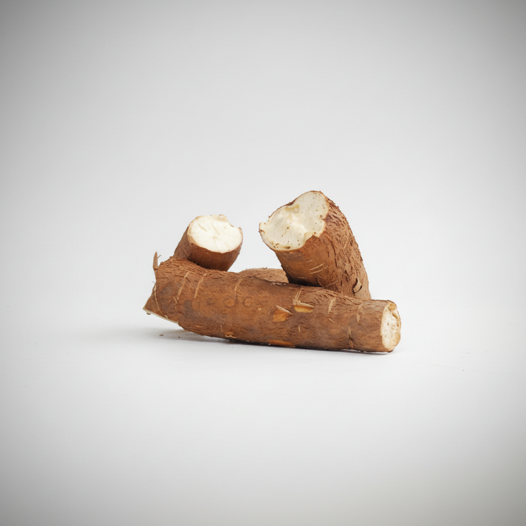 A fresh cassava root with a brown skin, partially peeled, with the AFRICAN GROCERY logo visible in the corner.