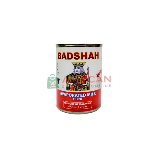 A can of Badshah brand evaporated milk, with a decorative label featuring a king.