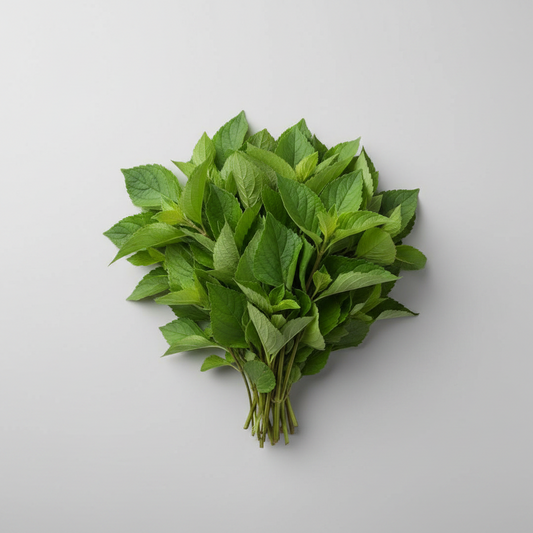 Bunch of fresh green leaves on a brown paper background