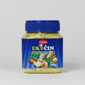 Jar of Yumis Ek Cin food seasoning with vegetables on a blurred background