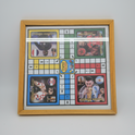 A square wooden-framed board game featuring soccer player cards. The game board has colored squares in white, yellow, green, blue, and red, with player paths and a central 'Original' token area.