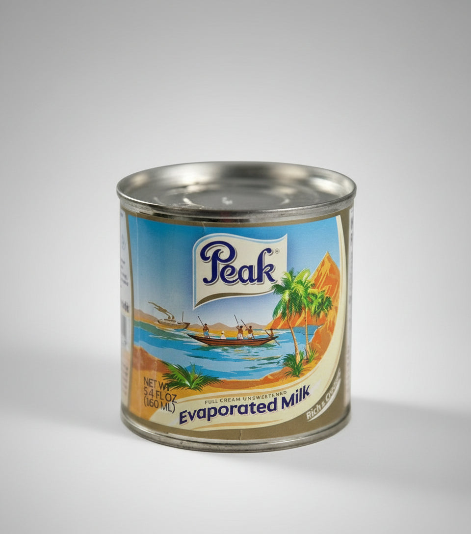 Can of Peak evaporated milk with a scenic label